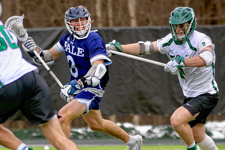 Yale University's Peter Moynihan, left, is pursued by Dartmouth's Eli Goldstein during the Ivy League teams' April 13, 2024, meeting on Scully-Fahey Field in Hanover, N.H. Yale won, 20-13. (Valley News - Tris Wykes) Copyright Valley News. May not be reprinted or used online without permission.