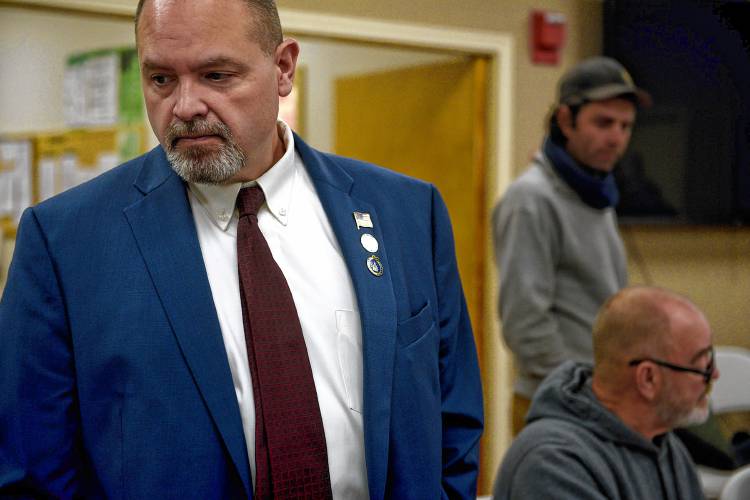 Claremont City Councilor Jonathan Stone, left, watches votes being counted with incoming city councilor Jonathan Hayden, in the background, at City Hall in Claremont, N.H. on Tuesday, Nov. 14, 2023. Hayden defeated Stone for the Ward III seat 247-241. Stone asked for a recount of the results, which did not change. At lower right is Ward III Moderator Bill Blewitt counting votes. (Valley News - Jennifer Hauck) Copyright Valley News. May not be reprinted or used online without permission. Send requests to permission@vnews.com.