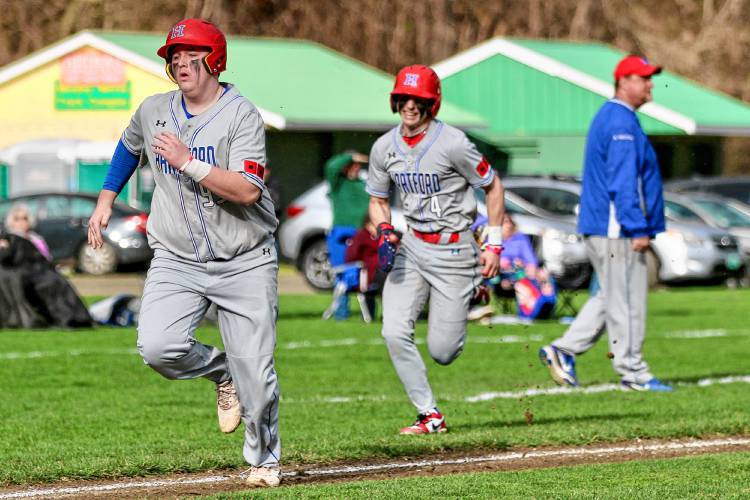 Hartford High's Matt Cooney, left, hustles to stay ahead of Cam Bradford on the bases during the Hurricanes' 18-0 defeat of Windsor on April 15, 2024, in Windsor, Vt. (Valley News - Tris Wykes) Copyright Valley News. May not be reprinted or used online without permission. 