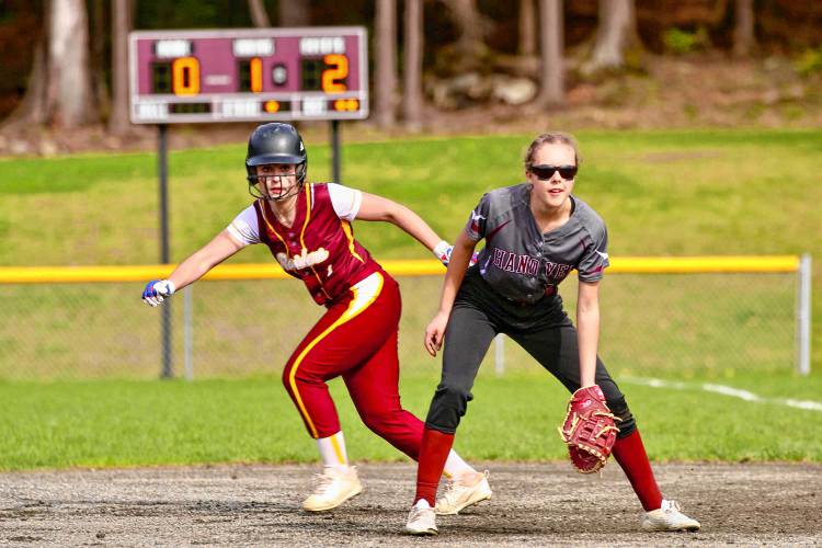 Lebanon High's Olivia Pollard leads off first base behind Hanover's Bella Hunt during the NHIAA Division II teams' April 28, 2023, game at the Dresden Fields in Norwich, Vt. (Valley News - Tris Wykes) Copyright Valley News. May not be reprinted or used online without permission. Send requests to permission@vnews.com.