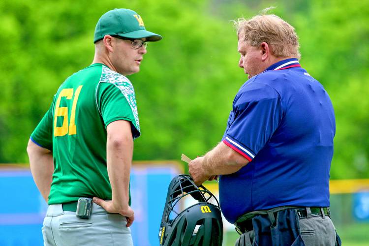 White River Valley baseball coach Devin Cilley meets with umpire Al Baesmann of St. Johnsbury, Vt., to inform the arbiter of lineup changes during a Vermont Division III quarterfinal matchup with visiting Windsor. White River Valley won the game, 1-0, on June 5, 2023, in South Royalton, Vt. (Valley News - Tris Wykes) Copyright Valley News. May not be reprinted or used online without permission. Send requests to permission@vnews.com.