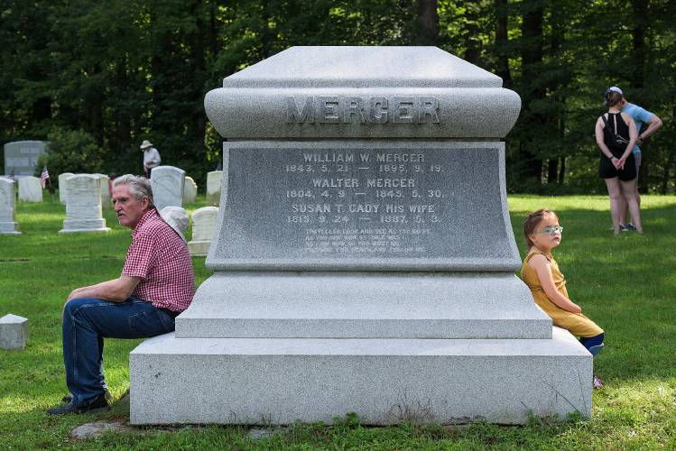 Stan Woodward, of Claremont, left, rests out of the sun as Eleanor Sharff, 7, sits opposite after a tour of Fitch family graves at the Chase Cemetery in Cornish, N.H., on Saturday, July 29, 2023. Woodward's mother was a member of the Fitch family who settled in the area in the 1770s. (Valley News - James M. Patterson) Copyright Valley News. May not be reprinted or used online without permission. Send requests to permission@vnews.com.