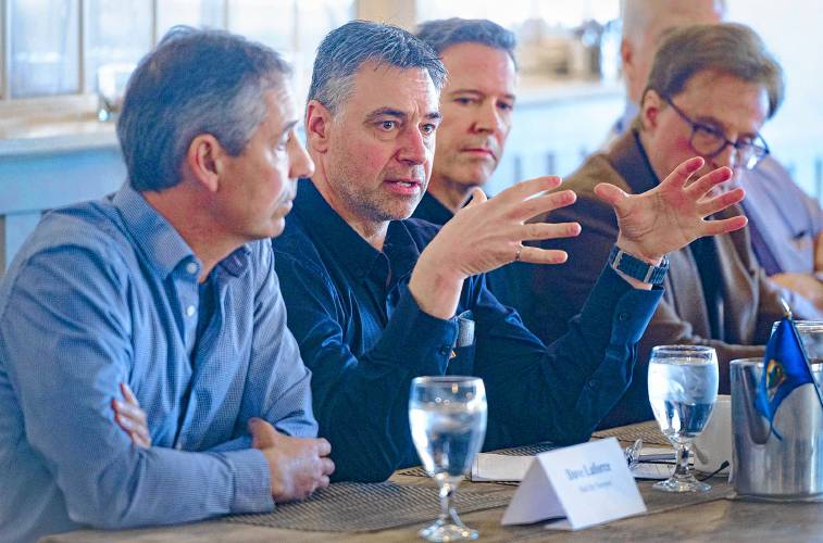 Denis Larue, whose company makes industrial snowblowers in Canada, speaks during a roundtable discussion on the possible effects of tariffs and a trade war between the U.S. and Canada in Newport, Vt., on Tuesday, March 18, 2025. (VtDigger - Glenn Russell)