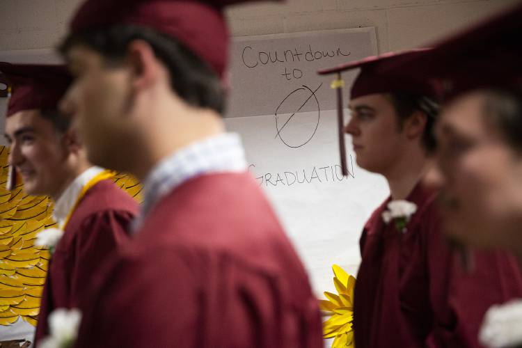 Seniors walk by a countdown to graduation before their graduation ceremony at Lebanon High School in Lebanon, N.H., on Thursday, June 8, 2023. (Valley News / Report For America - Alex Driehaus) Copyright Valley News. May not be reprinted or used online without permission. Send requests to permission@vnews.com.