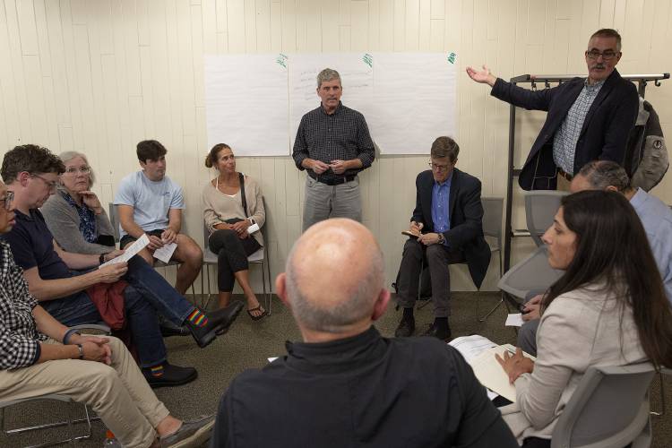Hanover director of public works Pete Kulbacki, center, Selectboard chair Carey Callaghan, second from right, and interim town manager Robert Houseman, right, take feedback from members of the public regarding the arrest of protesters on the Dartmouth College Green on May 1, during a listening session held by the Hanover Selectboard at the Howe Library in Hanover, N.H., on Tuesday, Aug. 20, 2024. The session was organized after residents expressed a desire for accountability and information during Town Meeting in May, which Selectboard members said was not the correct venue for that discussion. (Valley News - Alex Driehaus) Copyright Valley News. May not be reprinted or used online without permission. Send requests to permission@vnews.com.
