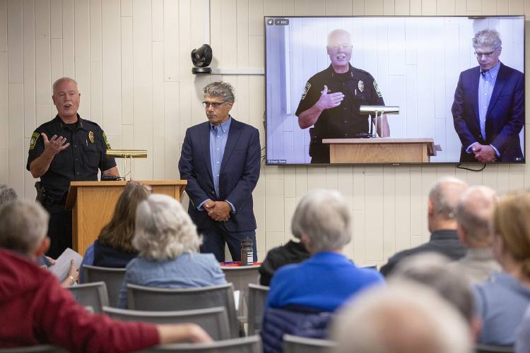 Hanover Police Chief Charlie Dennis, left, answers questions posed by Selectboard member Athos Rassias regarding the structure and general operation of the police department during a listening session at the Howe Library in Hanover, N.H., on Tuesday, Aug. 20, 2024. Dennis said he was unable to speak directly to the events surrounding the arrests that took place on May 1, and did not take questions from members of the public who were in attendance. (Valley News - Alex Driehaus) Copyright Valley News. May not be reprinted or used online without permission. Send requests to permission@vnews.com.