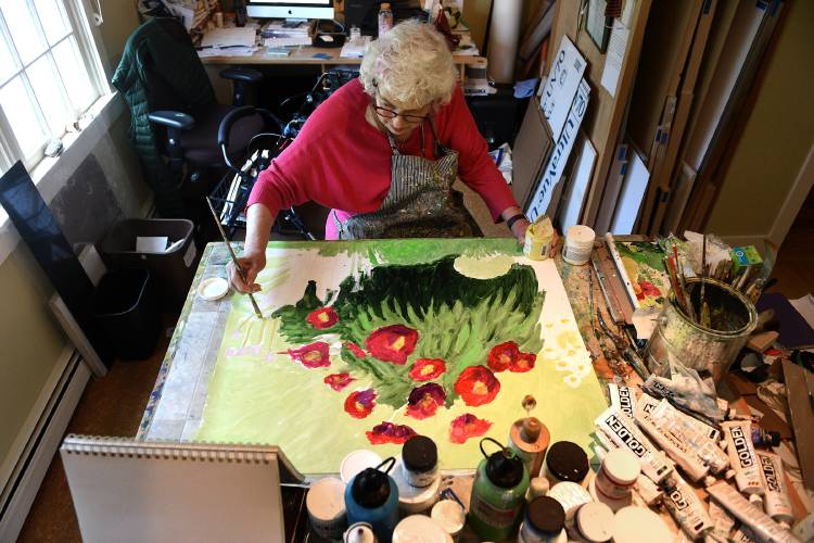 Peggy Kannenstine, of Pomfret, Vt., works on a painting of Japanese peonies at her home on Tuesday, July 12, 2022. Her exhibit of Ottauquechee River paintings has just been extended through August at the Vermont Institute of Natural Science in Quechee, Vt. ( Valley News - Jennifer Hauck) Copyright Valley News. May not be reprinted or used online without permission. Send requests to permission@vnews.com.