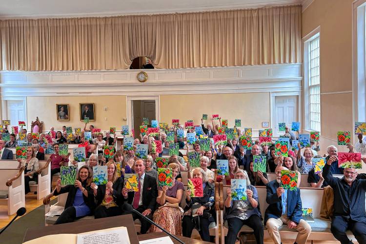 Those who attended Peggy Kannenstine's memorial service in Woodstock, Vt., on June 8, 2024, showed her paintings that were part of the program. Kannenstine died in November. (Beth Lampe photograph)