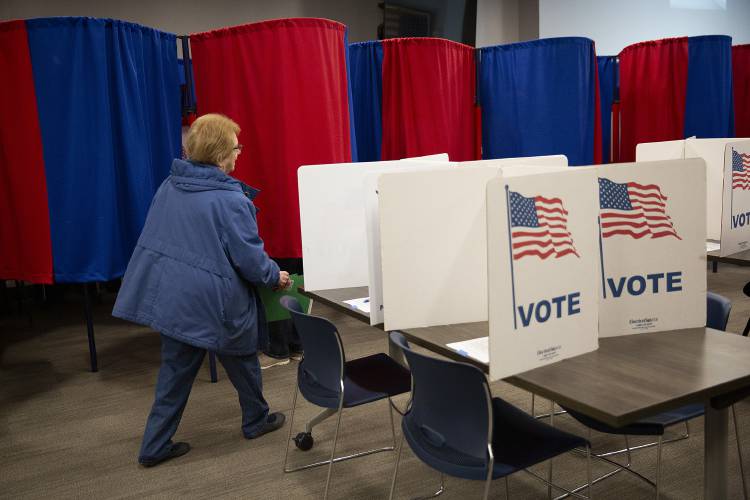 Jackie LeBlanc prepares to vote at City Hall in Lebanon, N.H., on Tuesday, March 11, 2025. Lebanon voters were asked to weigh in on elected officials, charter amendments and several zoning articles. (Valley News - Alex Driehaus)
