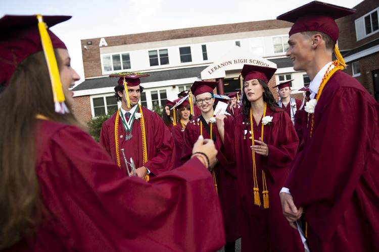 From left, Mary Rainey, Tanner Ames, Juliette Hampton, Lily Poljacik and Sean Miller joke around as they wait in line before their graduation ceremony at Lebanon High School in Lebanon, N.H., on Thursday, June 8, 2023. (Valley News / Report For America - Alex Driehaus) Copyright Valley News. May not be reprinted or used online without permission. Send requests to permission@vnews.com.