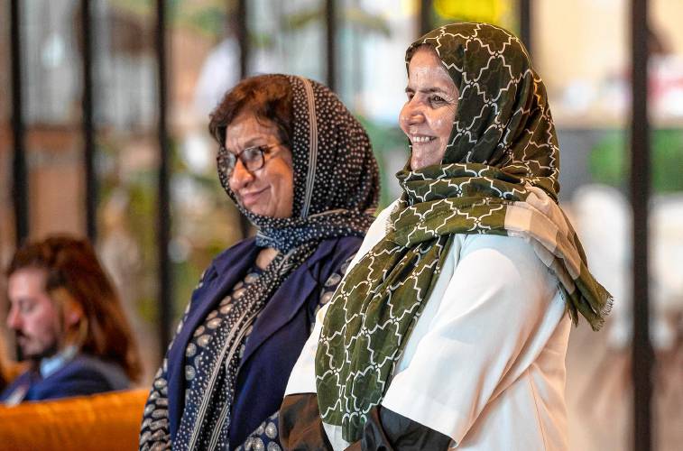 Anisa Rasooli, right, and Hamida Punjshiri, who were judges in Afghanistan, are recognized at a press conference focusing on the plight of Afghan refugees in Burlington on Monday, August 12, 2024. (VtDigger - Glenn Russell)
