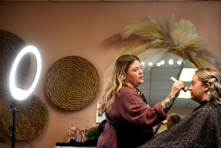 Meghan Brown, owner of Hidden Gem Studio and Makeover by Meg, applies makeup on client Shelby Soulia, of Andover, Vt., before Soulia's boudoir photography session on Tuesday, Jan. 9, 2024, in Claremont, N.H. (Valley News - Jennifer Hauck) Copyright Valley News. May not be reprinted or used online without permission. Send requests to permission@vnews.com.