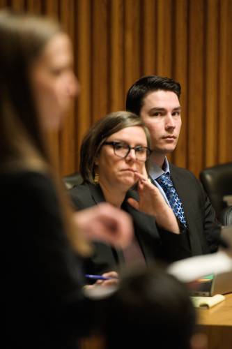 Kyle Clampitt, right, and his defense attorney Robin Melone, middle, listen to Assistant Grafton County Attorney Amanda Jacobson, left, on the first day of Clampitt’s trial on 12 charges of aggravated felonious sexual assault at Grafton Superior Court in North Haverhill, N.H., on Friday, Jan. 24, 2025. (Valley News - James M. Patterson)