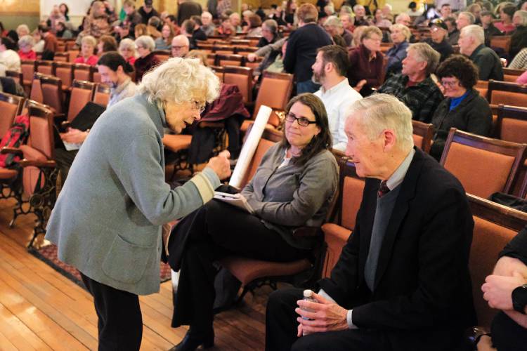 Sharon Francis, left, speaks with Acuity Management President Peter Cameron, right, before a New Hampshire Department of Environmental Services public hearing at the Claremont, N.H., Opera House on March 6, 2025. Francis attended to speak against Acuity Management's request to allow the sorting of construction and demolition waste at its existing facility. Residents and lawmakers spoke overwhelmingly in opposition to the proposed permit modification. (Valley News - James M. Patterson) Copyright Valley News. May not be reprinted or used online without permission. Send requests to permission@vnews.com.