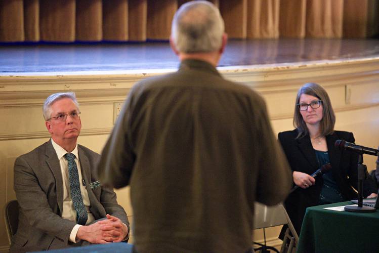 Jim Contois, middle, speaks in opposition of Acuity Management’s proposal to accept and sort construction and demolition waste at its Claremont, N.H., site to Waste Management Division Director Mike Wimsatt, left, and Assistant Director Sarah Yuhas Kirn, right, during a New Hampshire Department of Environmental Services hearing at the Claremont Opera House on March 6, 2025. (Valley News - James M. Patterson) Copyright Valley News. May not be reprinted or used online without permission. Send requests to permission@vnews.com.