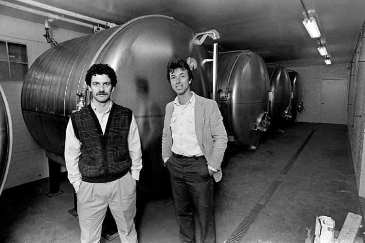 Catamount Brewery co-owner Alan Davis and brewmaster Stephan Mason, right, have filled their old plant in White River Junction, Vt., with new equipment like these tanks on May 12, 1986. (Valley News - Dan Hunting)