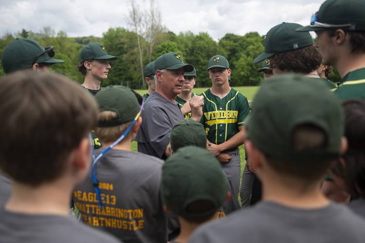 Windsor head coach Jamie Richardson, center, gives his players a pep talk before a varsity baseball game against Woodstock at Windsor High School in Windsor, Vt., on Thursday, May 16, 2024. Woodstock won, 27-5. (Valley News / Report For America - Alex Driehaus) Copyright Valley News. May not be reprinted or used online without permission. Send requests to permission@vnews.com.