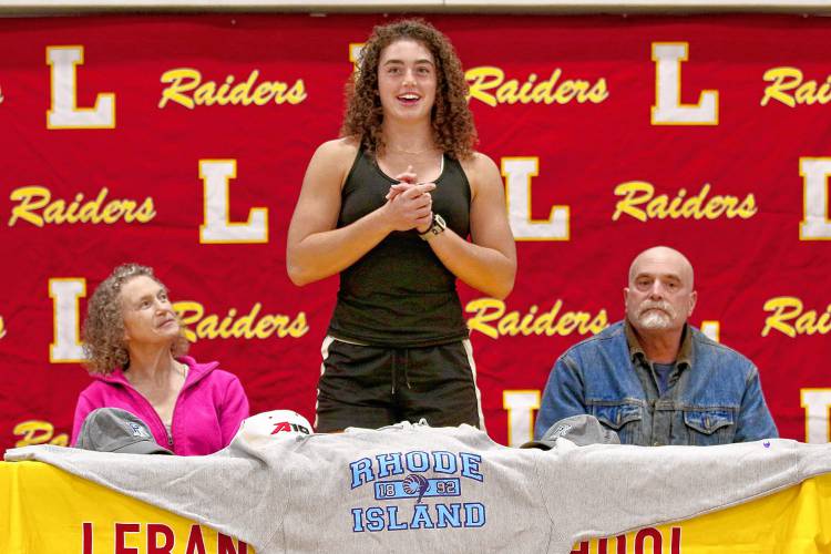 Anna Numme, center, is joined by her mother, Pam Numme, and uncle, Donn Cann during her University of Rhode Island rowing scholarship announcement on April 21, 2023, at Lebanon High in Lebanon, N.H. (Valley News - Tris Wykes) Copyright Valley News. May not be reprinted or used online without permission. Send requests to permission@vnews.com.