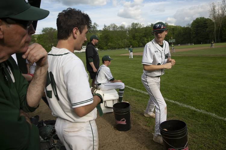 Woodstock’s Keller Pauly (8) gives teammate Josh Hough (20) a tip on his batting stance during a varsity baseball game at Windsor High School in Windsor, Vt., on Thursday, May 16, 2024. Woodstock won, 27-5. (Valley News / Report For America - Alex Driehaus) Copyright Valley News. May not be reprinted or used online without permission. Send requests to permission@vnews.com.