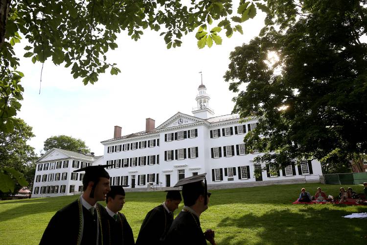 Dartmouth College graduates walk past Dartmouth Hall to line up with other students for commencement in Hanover, N.H., on June 12, 2022. (Valley News - Geoff Hansen) Copyright Valley News. May not be reprinted or used online without permission. Send requests to permission@vnews.com. Dartmouth College graduates walk past Dartmouth Hall to line up with other students for commencement in Hanover, N.H., on June 12, 2022. (Valley News - Geoff Hansen) Copyright Valley News. May not be reprinted or used online without permission. Send requests to permission@vnews.com.
