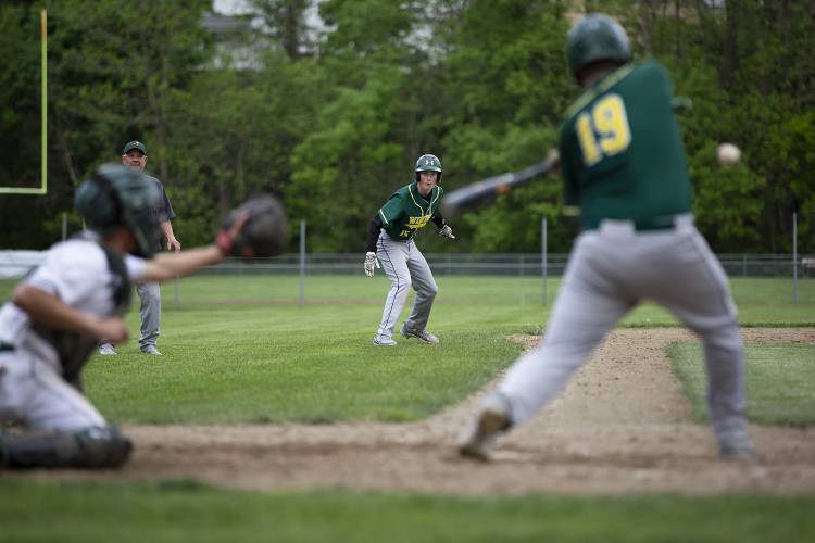 Windsor’s Nate Griffin (15) prepares for his dash to home plate while watching Lee Bevis (19) at bat during a varsity baseball game against Woodstock at Windsor High School in Windsor, Vt., on Thursday, May 16, 2024. Woodstock won, 27-5. (Valley News / Report For America - Alex Driehaus) Copyright Valley News. May not be reprinted or used online without permission. Send requests to permission@vnews.com.