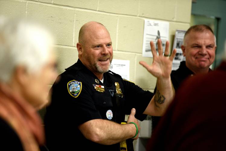 Lyme Police Chief Shaun J. O'Keefe waves to the crowd at the start of Lyme’s Town Meeting on Tuesday, March 11, 2025, in Lyme, N.H. O'Keefe has announced his retirement this year. (Valley News-Jennifer Hauck)