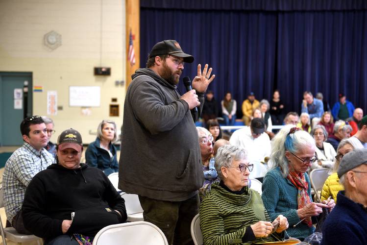 Lyme resident Jed Smith speaks about the cleanup on his properties at the Lyme Town Meeting in Lyme, N.H., on March 11, 2025. (Valley News-Jennifer Hauck)