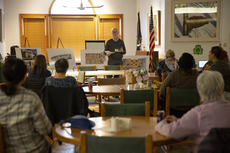 Executive director Michael Redmond introduces the plan for construction on the Upper Valley Haven’s new shelter and resource center during a community meeting at the Bugbee Senior Center in White River Junction, Vt., on Thursday, March 13, 2025. The planned 20-bed low-barrier shelter will have conference rooms where people staying in the shelter can meet with representatives of social service organizations, and will have common areas where people can spend daytime hours. “We spent a lot of time talking about safety, both inside and outside,” Redmond said. (Valley News - Alex Driehaus)
