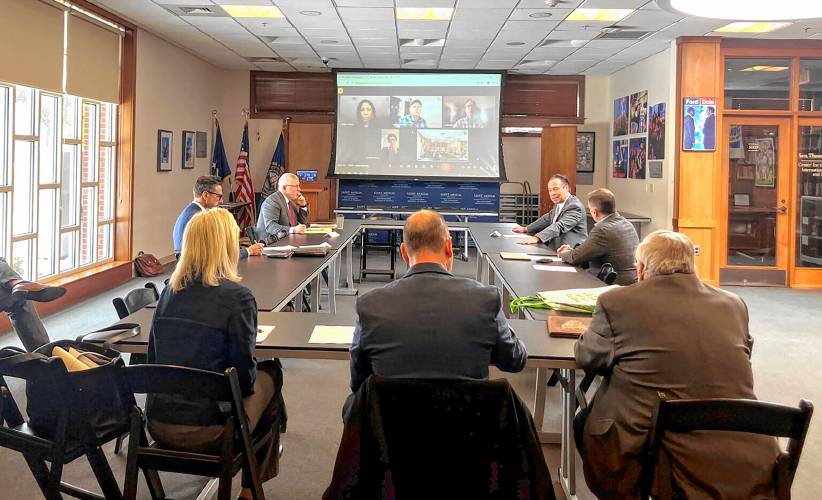Former Gov. Craig Benson, back right, addresses the New Hampshire Commission on Government Efficiency (COGE) at its inaugural meeting Wednesday, Feb. 26, 2025. (New Hampshire Bulletin - Ethan Dewitt)