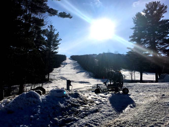 The sun shines brightly on two of the eight trails open at Ragged Ski area on Monday, December 4, 2107. Rain is moving in today but colder tempertures are due later in the week.