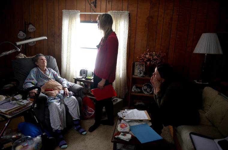 Dr. Elizabeth Mann, a member of the senior care team at Alice Peck Day Memorial Hospital, speaks with Norma Tuttle, of Hartford, Vt., at her home on Thursday, Feb. 13, 2025, during a home visit with Hartford Community Nurse Katie Williams. (Valley News-Jennifer Hauck)