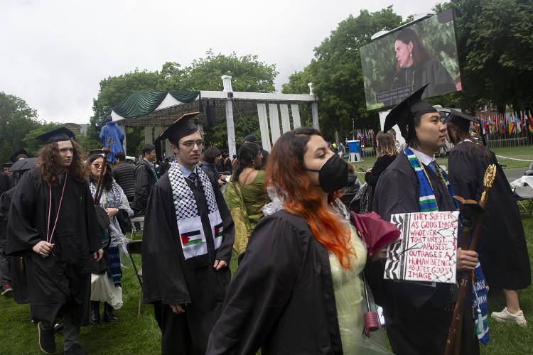 Pro-Palestinian graduates walk out in protest during Dartmouth President Sian Leah Beilock’s valedictory speech during the Dartmouth College commencement ceremony on the green in Hanover, N.H., on Sunday, June 9, 2024. (Valley News - Alex Driehaus) Copyright Valley News. May not be reprinted or used online without permission. Send requests to permission@vnews.com.