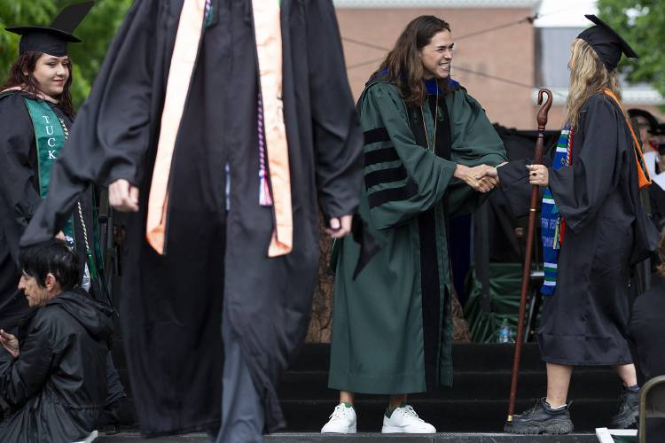 Dartmouth President Sian Leah Beilock shakes hands with graduates during the Dartmouth College commencement ceremony on the green in Hanover, N.H., on Sunday, June 9, 2024. (Valley News - Alex Driehaus) Copyright Valley News. May not be reprinted or used online without permission. Send requests to permission@vnews.com.