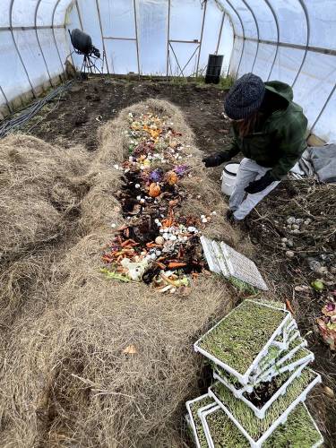 Food scraps and garden waste are added to the compost piles at Sweet Beet Farm in Bradford