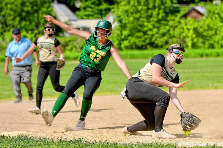 Windsor High third baseman Bri Barton, right, scoops a low throw while White River Valley's Olivia Teller (23) skids onto the bag behind her. Yellowjackets shortstop Gianna Felice (7) backs up the play. White River Valley won the Vermont Division III contest, 15-12. (Valley News - Tris Wykes) Copyright Valley News. May not be reprinted or used online without permission. Send requests to permission@vnews.com. 