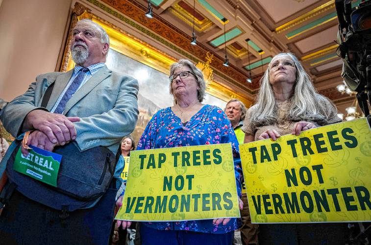 People listen during a press conference held by Downstream Vermonters, a coalition of people opposed to higher taxes and more regulations coming from the state government, at the Statehouse in Montpelier on Thursday, May 9, 2024. (VtDigger - Glenn Russell)