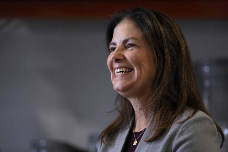 Republican gubernatorial candidate Kelly Ayotte, who faces Democrat Joyce Craig in the November 2024 election, smiles while talking with employees during a visit to a local concrete coating business, Wednesday, Oct. 16, 2024, in Manchester, N.H. (AP Photo/Charles Krupa)