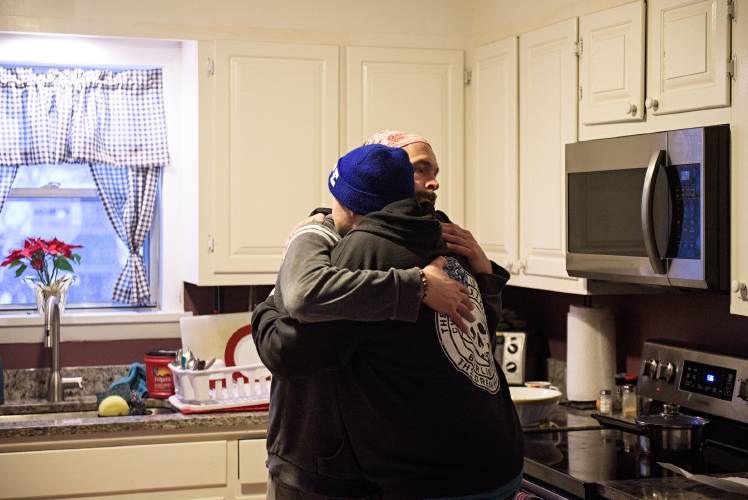 Chris Hoffman, back, thanks Recovery Coach Karl Coleman, front, for helping him get through a difficult day at Jack's House, a recovery house in White River Junction, Vt., on Thursday, Feb. 27, 2025. Jack's House and Willow Grove for women, providing five beds each and both run by Second Wind Foundation and Upper Valley Turning Point, are the only recovery houses in the core of the Upper Valley. A zoning amendment that would allow certified housing for people in substance use recovery in three residential districts will go before Lebanon voters on March 11. (Valley News - James M. Patterson) Copyright Valley News. May not be reprinted or used online without permission. Send requests to permission@vnews.com.