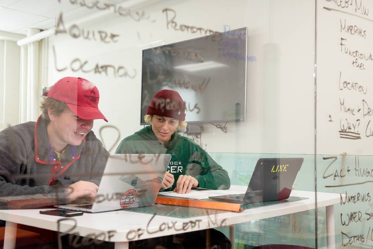Seniors Peter Borden, 17, left, and Isaac Emery, 18, right, work on their design for an in-ground trampoline in the Innovation Lab at Woodstock Union High School in Woodstock, Vt., Thursday, Nov. 15, 2018. Students in the IDEA class are currently working in small groups to create playground games and activities that they will design, model and build as part of a collaboration with a sister school in Turkey.(Valley News - James M. Patterson) Copyright Valley News. May not be reprinted or used online without permission. Send requests to permission@vnews.com.