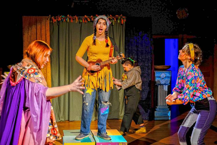 The Messenger, played by Dory Psomas, shares a tale with other townspeople (Laura Montgomery, Olivia Piepmeier and Julianne Borger) in the BarnArts production of Sophokles' 