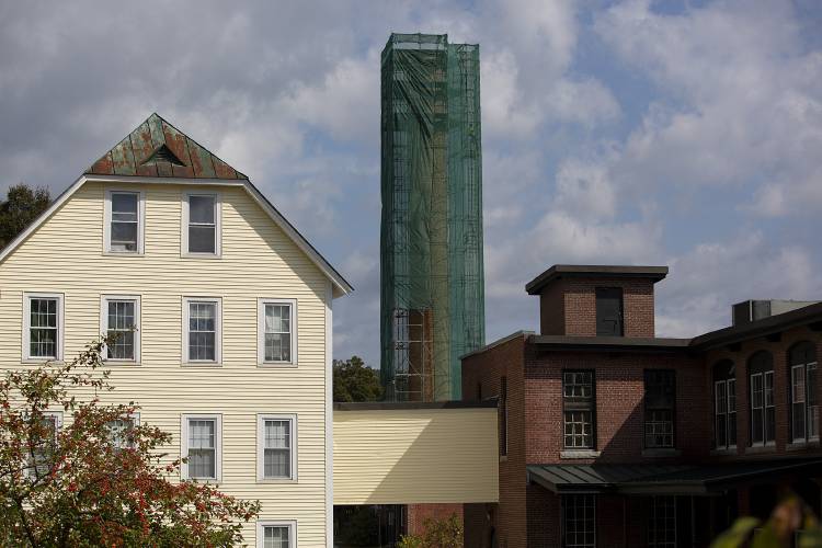 A crew from North Ridge Contracting prepares to demolish the smokestack at Rivermill Commercial Center in Lebanon, N.H., on Friday, Sept. 20, 2024. The commercial center occupies the historic mill building known as the Mascoma Flannel Mill, which was built in 1882, and is one of the last remaining mill buildings in the city. (Valley News - Alex Driehaus) Copyright Valley News. May not be reprinted or used online without permission. Send requests to permission@vnews.com.