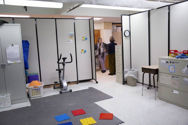 Principal Audra Bucklin, left, stops to talk in the hallway outside of an occupational and physical therapy space, surrounded by temporary walls, at Plainfield Elementary School in Meriden, N.H., on Friday, Feb. 28, 2025. The space would be renovated as part of a proposed $1.5 million project to update the school’s middle school wing, which would include creating a Science, Technology, Engineering, Arts and Mathematics, or STEAM, lab. (Valley News - Alex Driehaus)