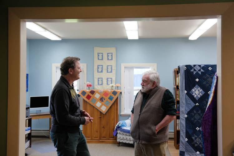 Vermont Sen. Dick McCormack, D-Windsor, of Bethel, 76, right, talks with Bethel (Vt.) Public Library Trustee Bennett Law, left, after a legislative breakfast on Monday, May 13, 2024. McCormack grew up in New York, but from a young age knew that he wanted to move to Bethel where he frequently visited family as a child. After working as a folk musician, he was appointed to the Senate in 1989. (Valley News - James M. Patterson) Copyright Valley News. May not be reprinted or used online without permission. Send requests to permission@vnews.com.