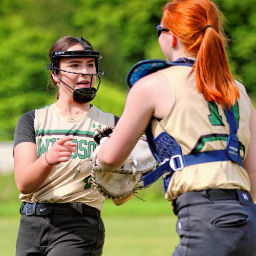 Windsor High pitcher Molly Burke, left, and catcher Cassie Clark congratulate each other after a strikeout ended a White River Valley at-bat during the Vermont Division III teams' May 25, 2024, game in South Royalton, Vt. White River Valley rallied for a 15-12 victory. (Valley News - Tris Wykes) Copyright Valley News. May not be reprinted or used online without permission. Send requests to permission@vnews.com. 