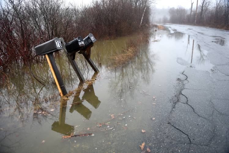 
Flooding from the Indian River pools around mailboxes on Potato Road in Canaan, N.H., on Monday, March 17, 2025. A section of the road was closed due to water across the roadway. (Valley News-Jennifer Hauck)